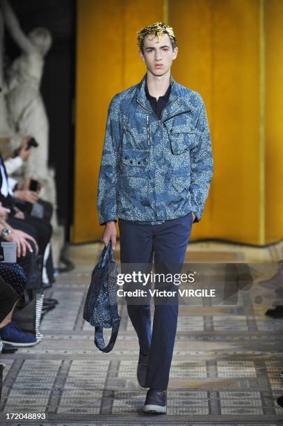 Model walks the runway during the Mihara Yasuhiro Ready to Wear Spring/Summer 2013 show as part of the Paris Men Fashion Week on June 29, 2012 in...