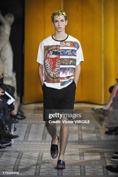 Model walks the runway during the Mihara Yasuhiro Ready to Wear Spring/Summer 2013 show as part of the Paris Men Fashion Week on June 29, 2012 in...
