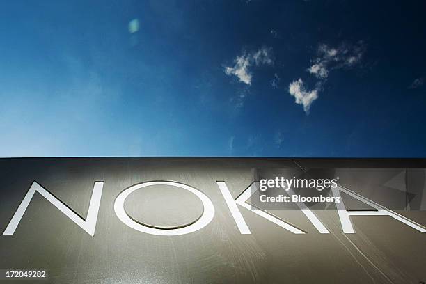 Sign stands outside the headquarters of Nokia Oyj in Espoo, Finland, on Monday, July 1, 2013. Nokia Oyj agreed to buy Siemens AG's share in a...