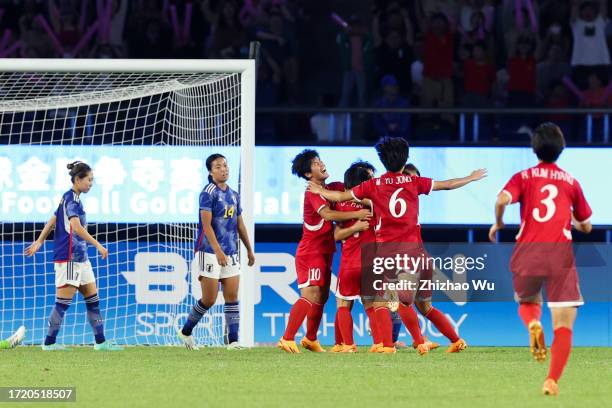 Kim Kyongyong of North Korea celebrates her goal during the 19th Asian Game Women's gold medal match between Japan and North Korea at Huanglong...