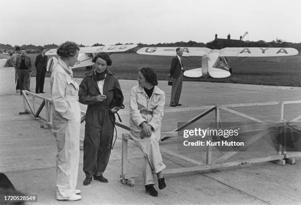 Trainee pilots of the National Women's Air Reserve chatting during a break at Chigwell Flying Ground near London, October 1938. More than 300 women...