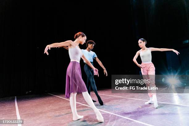 young ballet dancers rehearsing to perform in a stage theater - just dance 3 stock pictures, royalty-free photos & images