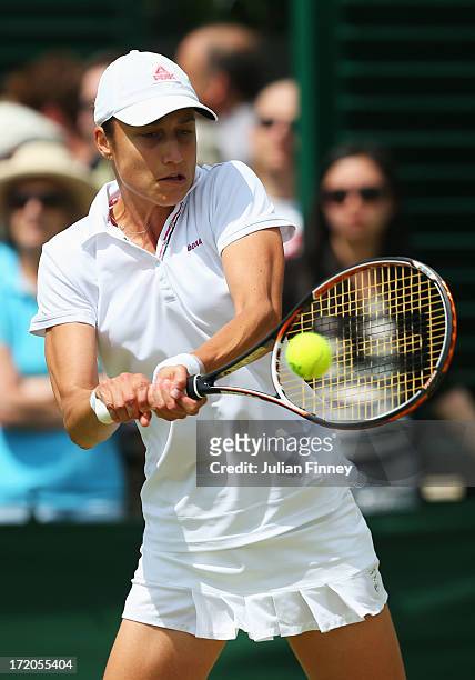Katarina Srebotnik of Slovenia plays a backhand during the Ladies' Doubles third round match between Vania King of the United States of America and...