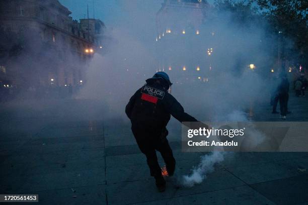 French riot police uses tear gas to disperse demonstrators during a pro-Palestinian rally at the Republique Square in Paris, France on October 12,...