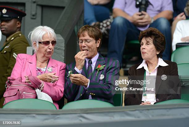 SIr Cliff Richard and former player Maria Bueno attend on Day 7 of the Wimbledon Lawn Tennis Championships at the All England Lawn Tennis and Croquet...