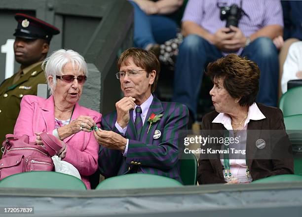 SIr Cliff Richard and former player Maria Bueno attend on Day 7 of the Wimbledon Lawn Tennis Championships at the All England Lawn Tennis and Croquet...
