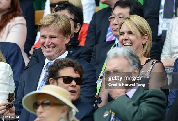 Ernie Els and wife Liezl attend on Day 7 of the Wimbledon Lawn Tennis Championships at the All England Lawn Tennis and Croquet Club at Wimbledon on...