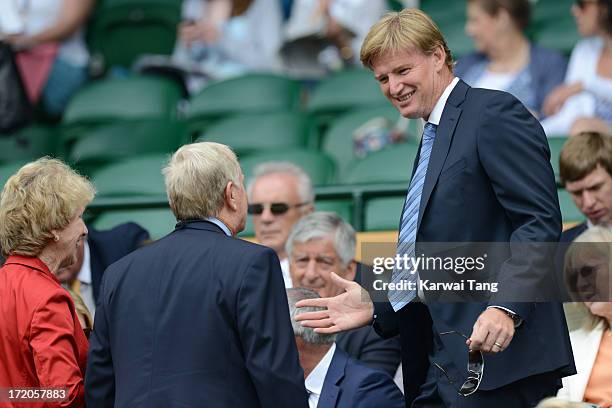 Jack Nicklaus and Ernie Els attend on Day 7 of the Wimbledon Lawn Tennis Championships at the All England Lawn Tennis and Croquet Club at Wimbledon...