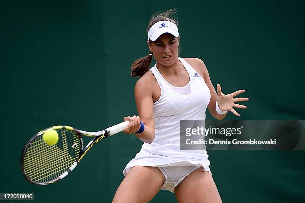 Monica Puig of Puerto Rico plays a forehand during her Ladies' Singles fourth round match against Sloane Stephens of United States of America on day...