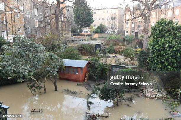 General View Of A Back Gardens Of Properties On Devonia Road Are Left Under Water In London.....Burst Water Main On Upper Street Islington, Gardens...