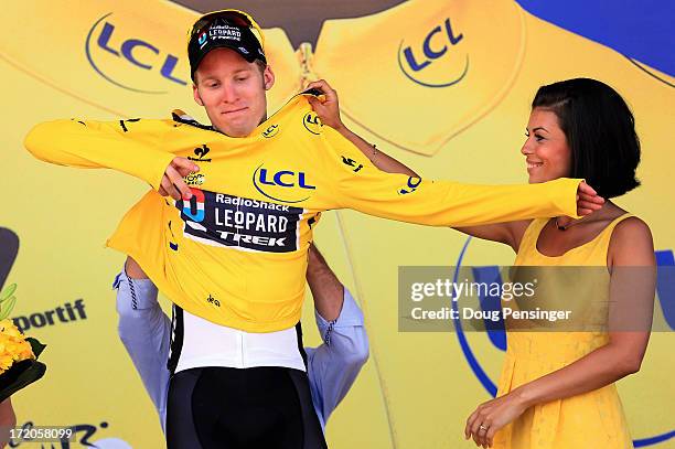 Jan Bakelants of Belgium riding for Radioshack Leopard takes to the podium after he defended the overall race leader's yellow jersey in stage three...