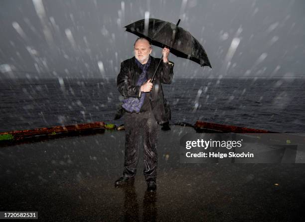 Jon Fosse poses in the rain after being awarded the Nobel Literature Prize on October 06, 2023 in Frekhaug, Norway. Jon Fosse, the Norwegian author...