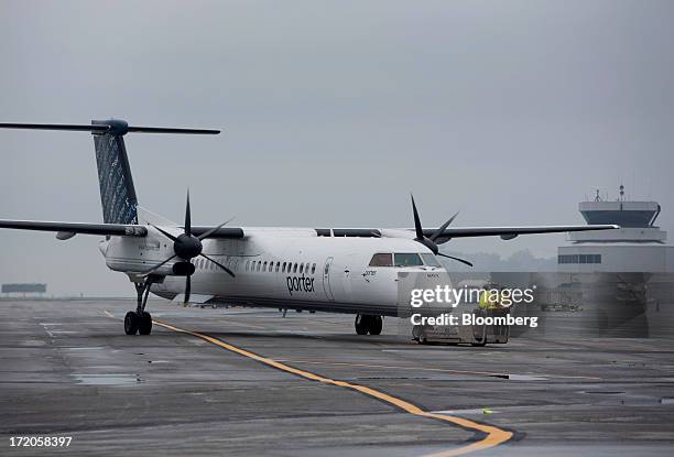 Porter Airlines Inc. Aircraft taxis on the runways at Billy Bishop Toronto City Airport in Toronto, Ontario, Canada, on Friday, June 28, 2013. Porter...