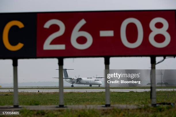 Porter Airlines Inc. Aircraft prepares to take off at Billy Bishop Toronto City Airport in Toronto, Ontario, Canada, on Friday, June 28, 2013. Porter...