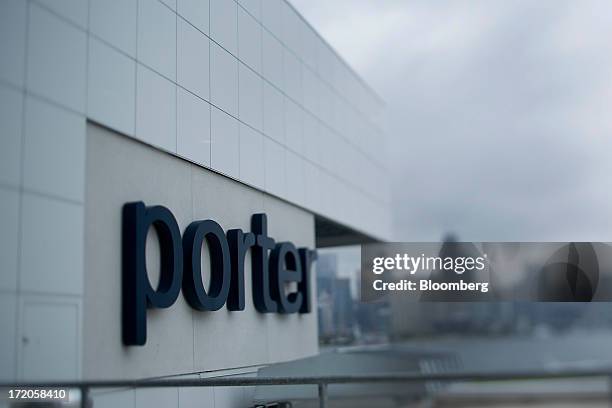 Porter Airlines signage, seen in this photograph taken with a tilt-shift lens, is displayed on a wall at Billy Bishop Toronto City Airport in...