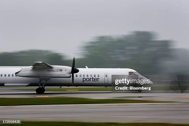 Porter Airlines Inc. Aircraft lands at Billy Bishop Toronto City Airport in Toronto, Ontario, Canada, on Friday, June 28, 2013. Porter Airlines Inc.,...