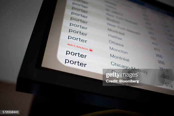 Porter Airlines Inc. And Air Canada fights are listed on a board at Billy Bishop Toronto City Airport in Toronto, Ontario, Canada, on Friday, June...