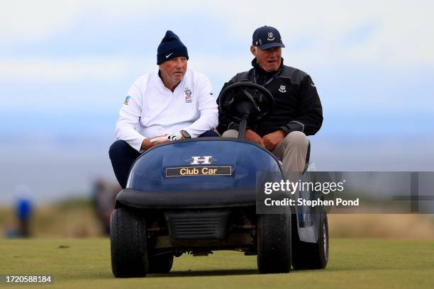 Former Cricketer and Member of the House of Lords, Ian Botham is driven on a buggy during Day Two of the Alfred Dunhill Links Championship at...