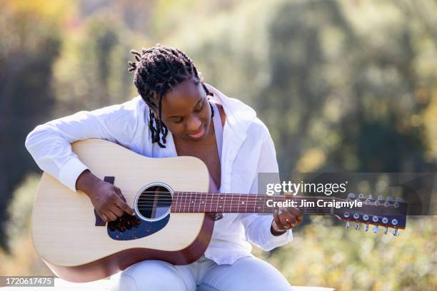 portrait africian american woman - jim craigmyle guitar stock pictures, royalty-free photos & images