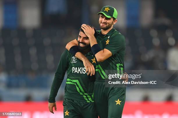 Fakhar Zaman of Pakistan celebrates with teammate Shaheen Shah Afridi after dismissing Vikramjit Singh of Netherlands during the ICC Men's Cricket...