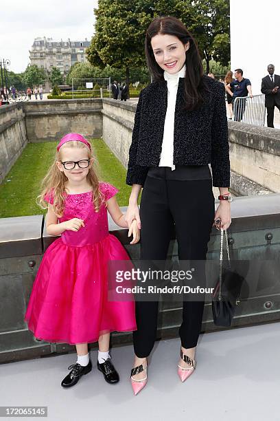 Anna Jukova and her daughter attend the Christian Dior show as part of Paris Fashion Week Haute-Couture Fall/Winter 2013-2014 at on July 1, 2013 in...