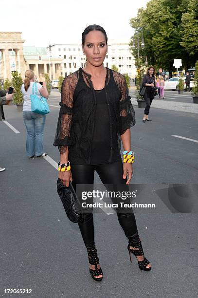 Barbara Becker attends the Mercedes-Benz Fashion Week Berlin Spring/Summer 2014 Preview Show by Grazia at the Brandenburg Gate on July 1, 2013 in...