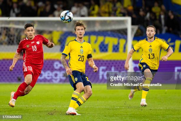 Sweden's Kristoffer Olsson and Gabriel Gudmundsson against Moldova's Maxim Cojocaru during the international friendly match between Sweden and...