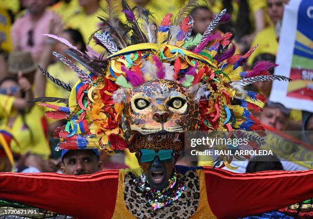 Supporter of Colombia cheers before the 2026 FIFA World Cup South American qualification football match between Colombia and Uruguay at the Roberto...