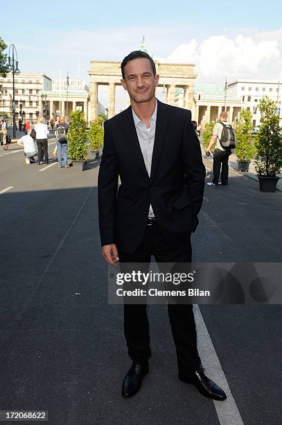 Soenke Moehring attends the Mercedes-Benz Fashion Week Berlin Spring/Summer 2014 Preview Show by Grazia at the Brandenburg Gate on July 1, 2013 in...