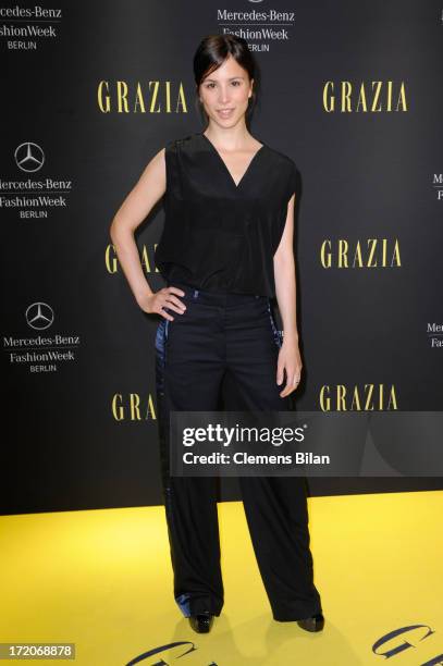 Aylin Tezel attends the Mercedes-Benz Fashion Week Berlin Spring/Summer 2014 Preview Show by Grazia at the Brandenburg Gate on July 1, 2013 in...