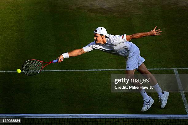 Tommy Haas of Germany plays a forehand during the Gentlemen's Singles fourth round match against Novak Djokovic of Serbia on day seven of the...