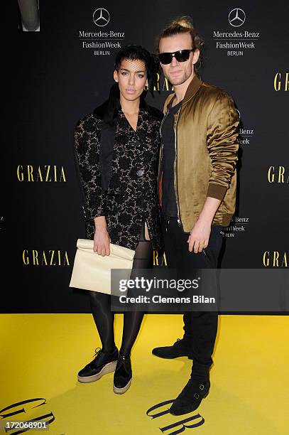 Singer Alina Sueggeler and Andreas Weizel attend the Mercedes-Benz Fashion Week Berlin Spring/Summer 2014 Preview Show by Grazia at the Brandenburg...