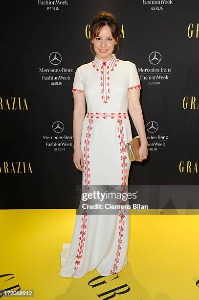 Mina Tander attends the Mercedes-Benz Fashion Week Berlin Spring/Summer 2014 Preview Show by Grazia at the Brandenburg Gate on July 1, 2013 in...