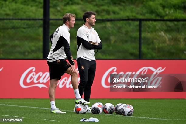 October 2023, USA, Foxborough: Soccer: national team, Germany, US international trip, training. German coach Julian Nagelsmann and his assistant...