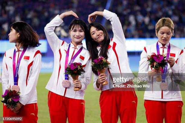 Players of China attend the award ceremony after the 19th Asian Game Women's gold medal match between Japan and North Korea at Huanglong Sports...