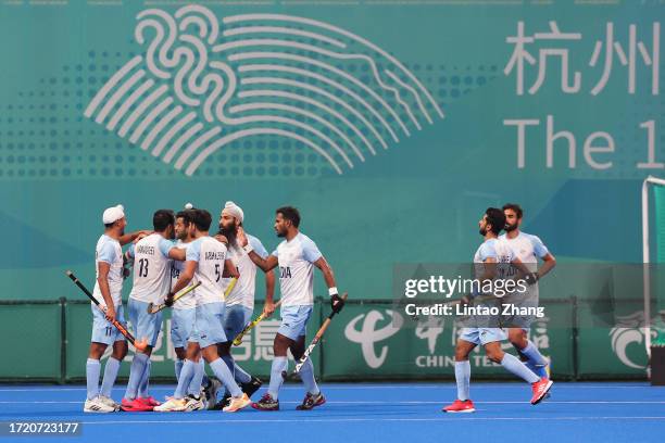 Harmanpreet Singh India celebrate a goal with teammate during the Asian Games Men's Final Hockey event match between Japan and India at Gongshu Canal...
