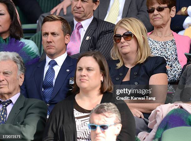 Ian Poulter and wife Katie attend on Day 7 of the Wimbledon Lawn Tennis Championships at the All England Lawn Tennis and Croquet Club on July 1, 2013...