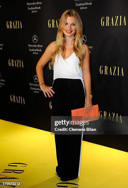 Susan Sideropoulos attends the Mercedes-Benz Fashion Week Berlin Spring/Summer 2014 Preview Show by Grazia at the Brandenburg Gate on July 1, 2013 in...