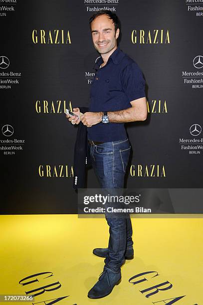 Ivan Strano attends the Mercedes-Benz Fashion Week Berlin Spring/Summer 2014 Preview Show by Grazia at the Brandenburg Gate on July 1, 2013 in...