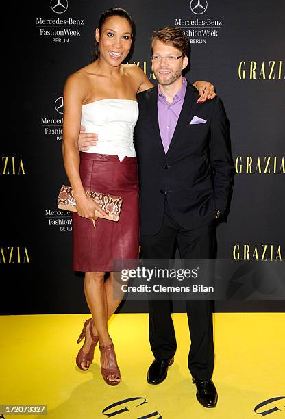 Annabelle Mandeng and Kai Rose attend the Mercedes-Benz Fashion Week Berlin Spring/Summer 2014 Preview Show by Grazia at the Brandenburg Gate on July...