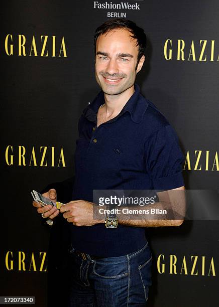 Ivan Strano attends the Mercedes-Benz Fashion Week Berlin Spring/Summer 2014 Preview Show by Grazia at the Brandenburg Gate on July 1, 2013 in...