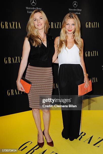 Kristin Meyer and Susan Sideropoulos attend the Mercedes-Benz Fashion Week Berlin Spring/Summer 2014 Preview Show by Grazia at the Brandenburg Gate...