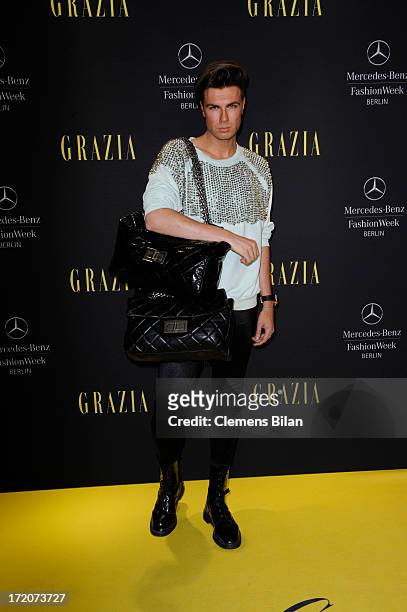 Andre Borchers attends the Mercedes-Benz Fashion Week Berlin Spring/Summer 2014 Preview Show by Grazia at the Brandenburg Gate on July 1, 2013 in...