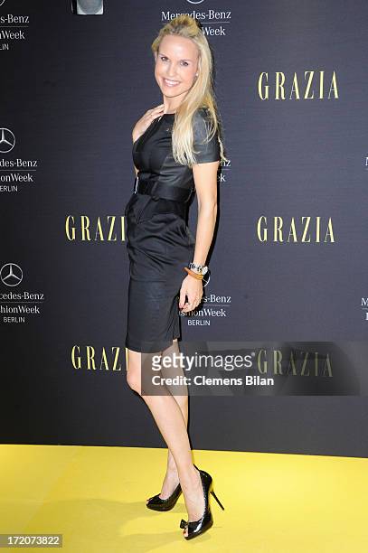 Tamara Sedmak attends the Mercedes-Benz Fashion Week Berlin Spring/Summer 2014 Preview Show by Grazia at the Brandenburg Gate on July 1, 2013 in...