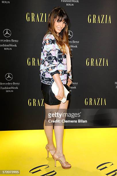Anna Wolfers attends the Mercedes-Benz Fashion Week Berlin Spring/Summer 2014 Preview Show by Grazia at the Brandenburg Gate on July 1, 2013 in...