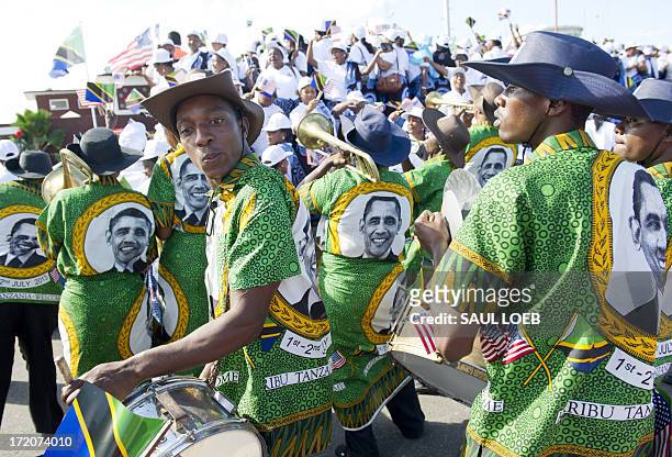 Local band plays as US President Barack Obama and First Lady Michelle Obama arrive on Air Force One at Julius Nyerere International Airport in Dar Es...