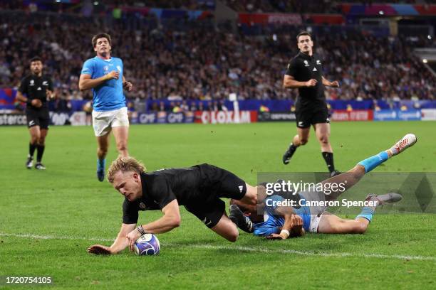 Damian McKenzie of the All Blacks attempts to score a try that was later disallowed during the Rugby World Cup France 2023 match between New Zealand...