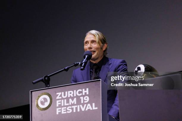 Mads Mikkelsen speaks on stage during the "The Promised Land" Premiere & Golden Eye Award for Mads Mikkelsen during the 19th Zurich Film Festival at...
