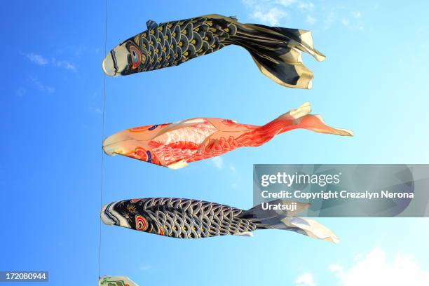 carp streamer (koinobori) on sky - koinobori stock pictures, royalty-free photos & images