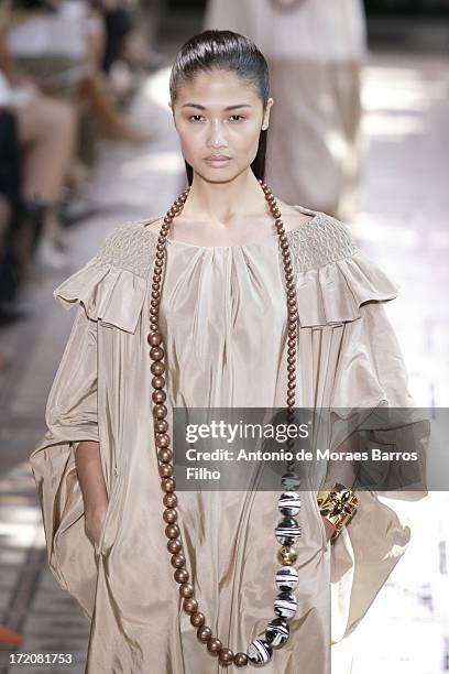 Model walks the runway during Christophe Josse show as part of Paris Fashion Week Haute-Couture Fall/Winter 2013-2014 at les Beaux Arts on July 1,...